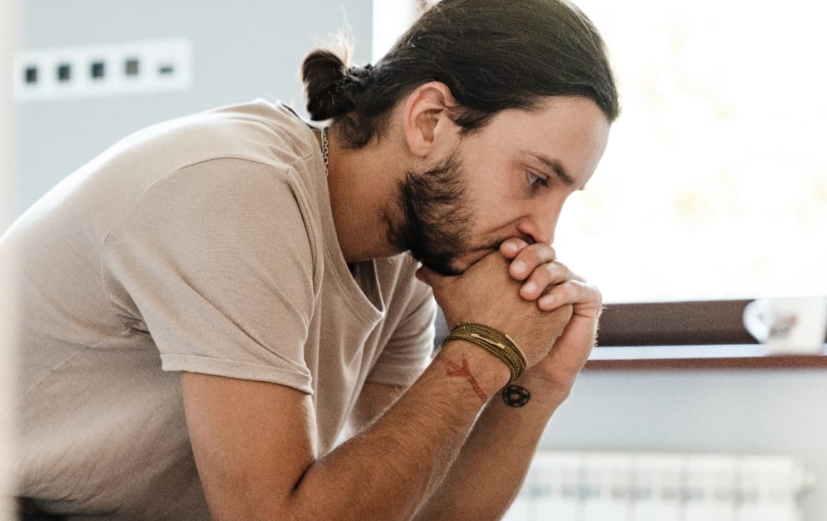Woman peering over balcony